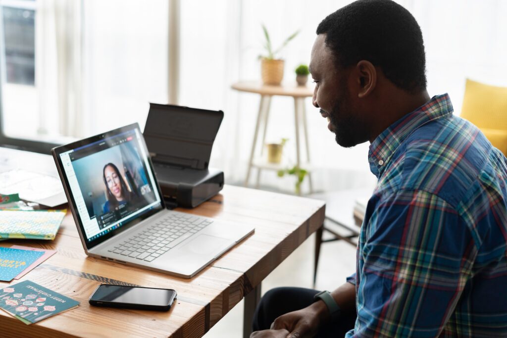 man and woman having an online meeting