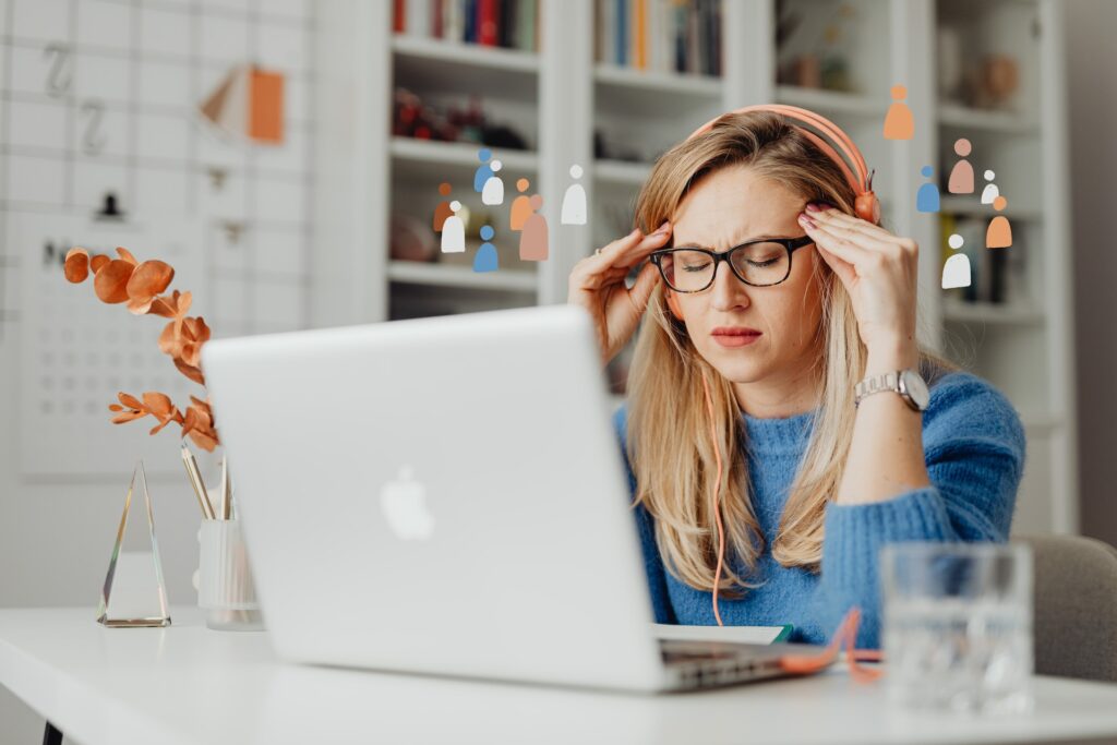 girl in front of a laptop, struggling to concentrate on her work