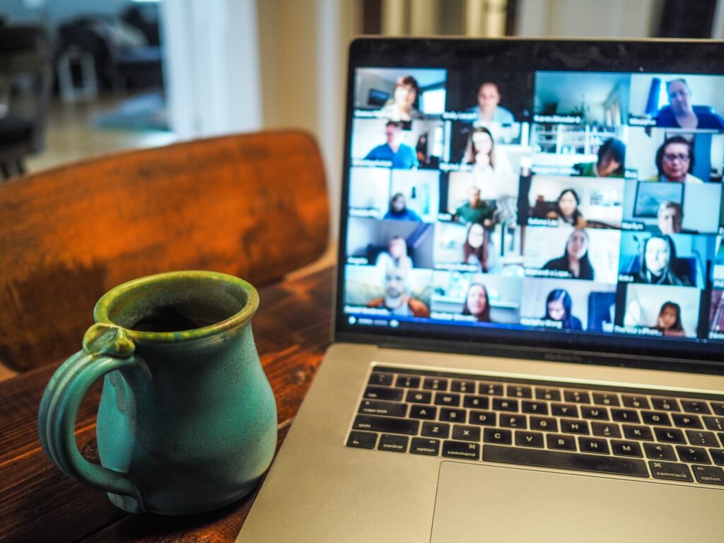 laptop screen showing an online meeting with coworkers